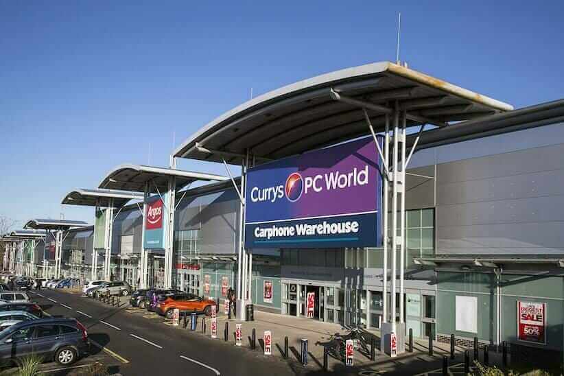 shutterstock_691126567 shopping centre currys front view of major retailer Currys PC world store against a blue sky
