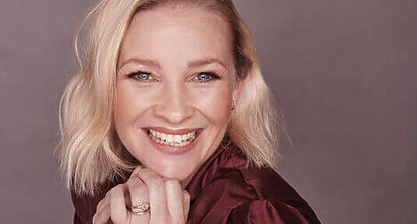 a head shot of light skinned actress joanna Page smiling