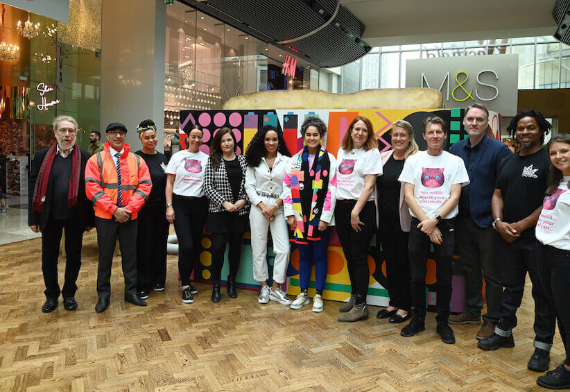 toaster campaign group westfield a group of about 20 people gathered in front of a giant toaster in westfield shopping centre