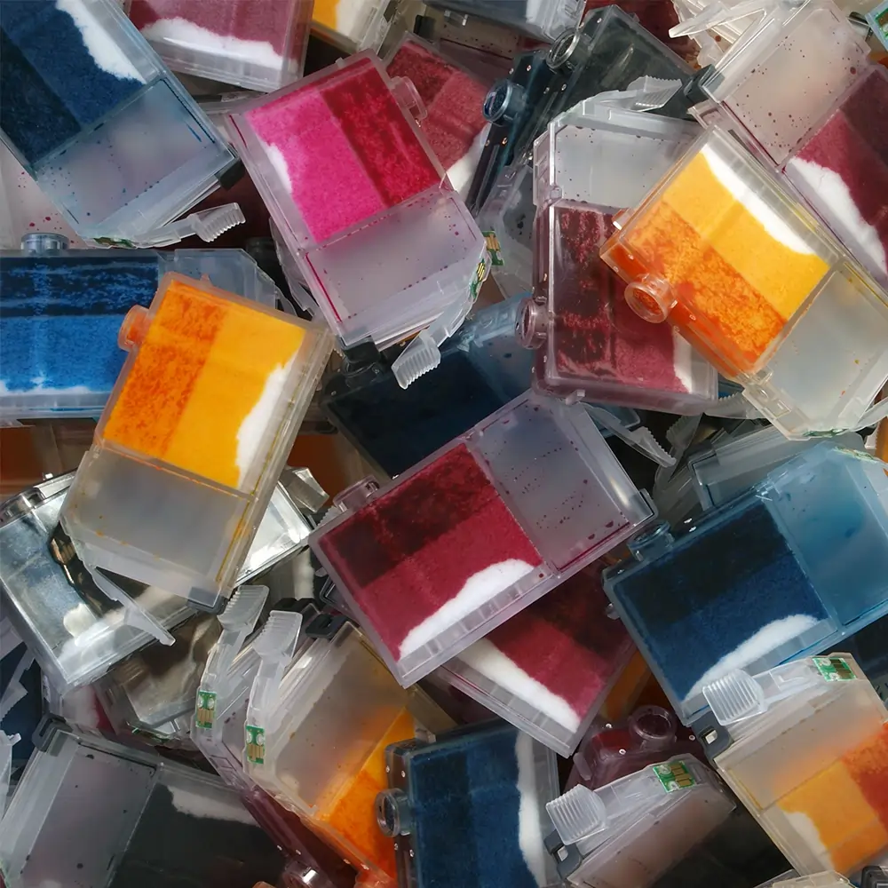 close up of lots of printer ink cartridges 1000 px close up on a pile of multicoloured printer cartridges