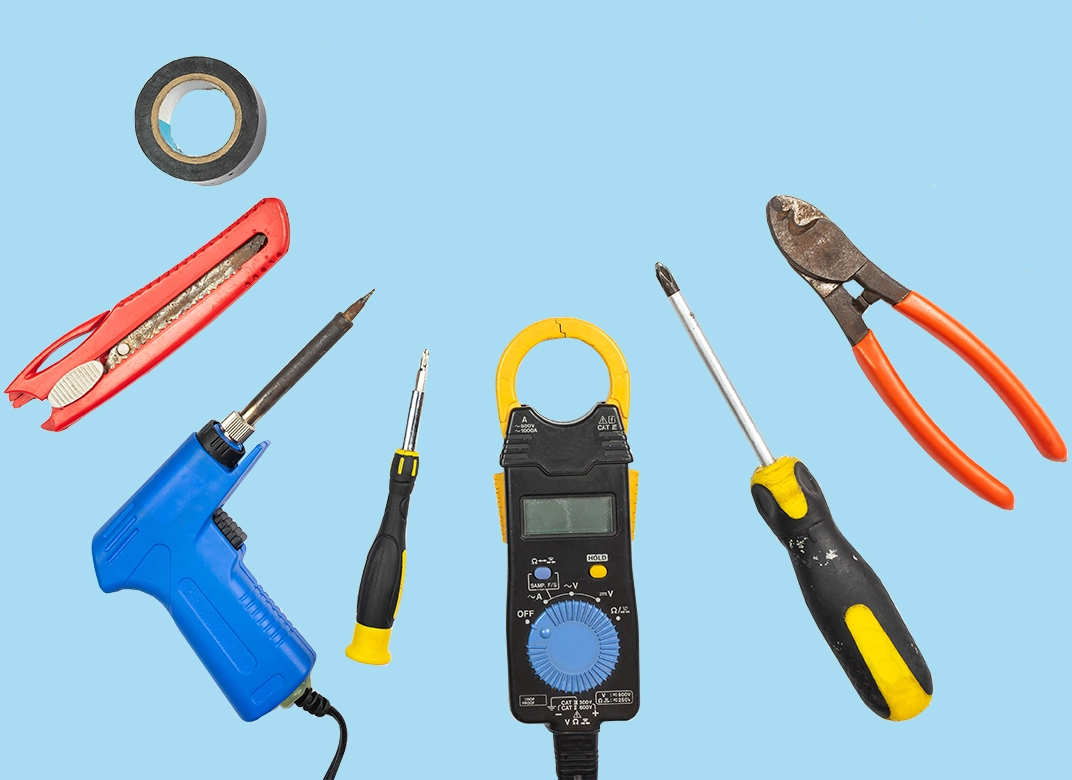 various repair tools on blu 2024 shutterstock_1639974118-1072x780 various electrical repair hand tools laid out in a semi circle on a blue background