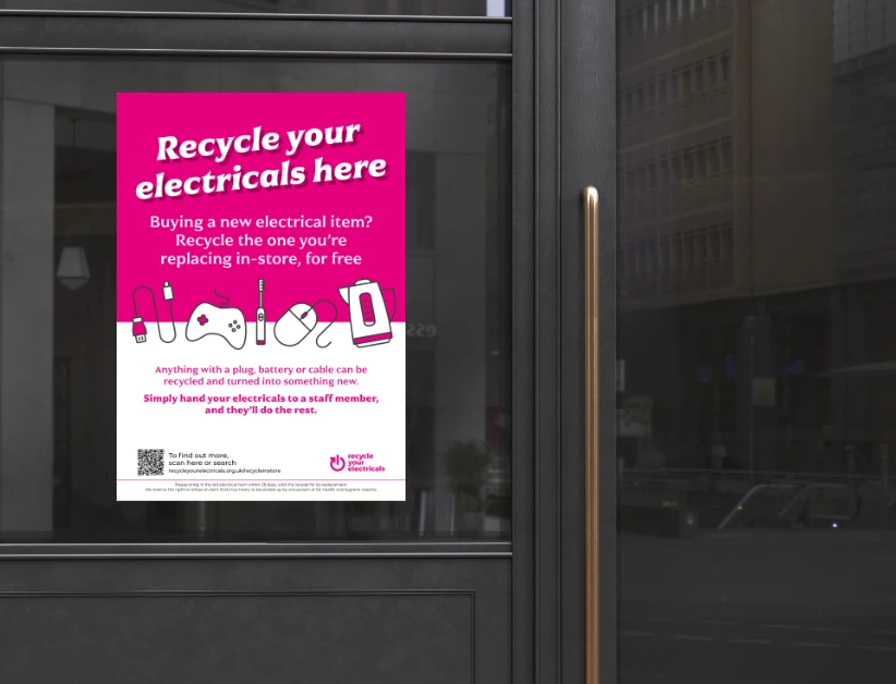 Recycle your electricals poster on a shop window 2024 px a 'recycle your electricals' poster on a shop window