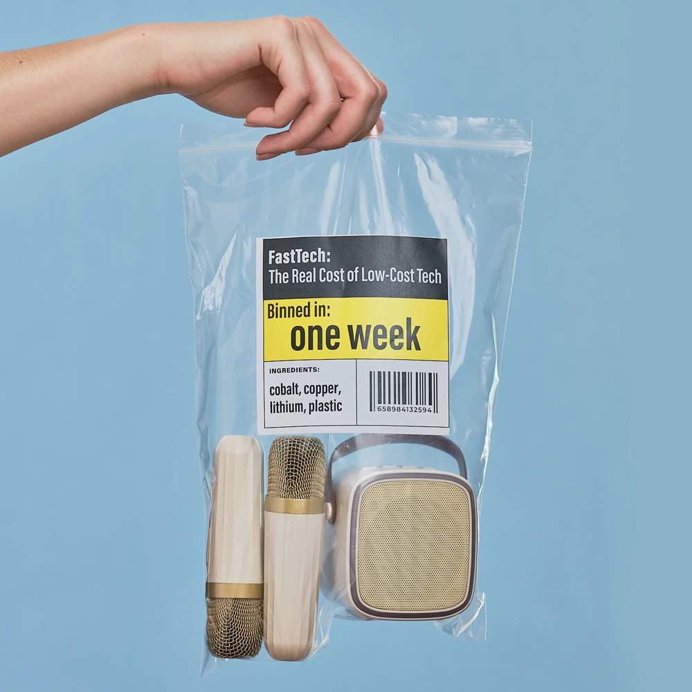 FastTech webpage header microphones in bag 1000px a pale skinned hand holdin a clear plastic bag with two small microphones and a speaker. The label on the bag says "one week"